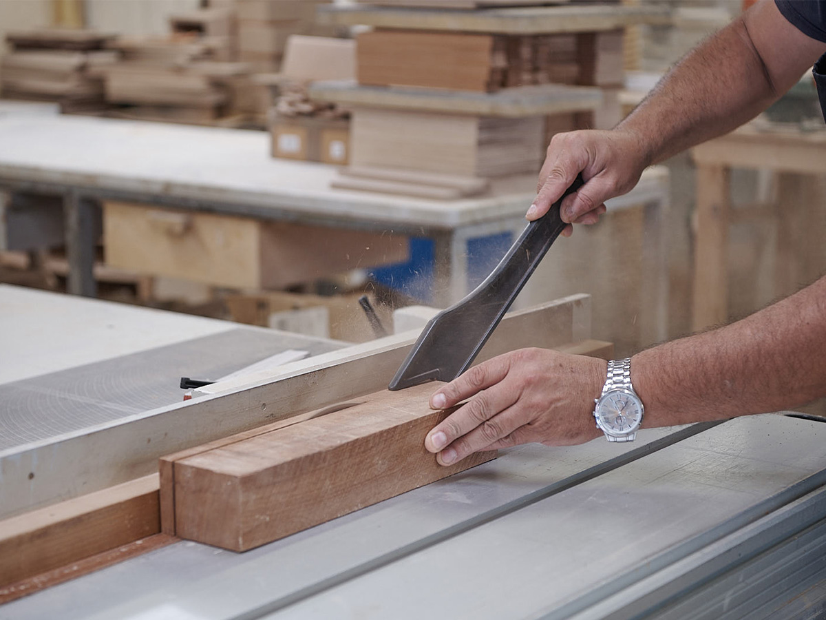 Craftsman shaping a block of wood for a Sorrento music box in the Ercolano workshop
