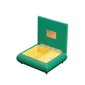 The Enchanted Picnic music box shown open, with its velvet-lined interior and gold wind-up movement, made in Sorrento