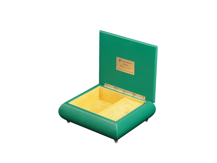 The Enchanted Picnic music box shown open, with its velvet-lined interior and gold wind-up movement, made in Sorrento